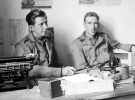 491st Bomb Squadron 1st Sergeant, Roy S. Bierbauer and an unidentified individual chat at the "Provost Sgt" desk in the orderly room, probably Yangkai, China.   (Info courtesy Tony Strotman)