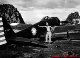 GI poses with an airplane with nationalist markings at Liuzhou base, Guangxi province.