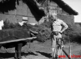 An American explores a village, probably at Yangkai, during WWII.