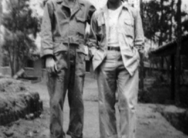 Thomas Clougherty, Fred Campangna pose on a pathway at an American base in the CBI, likely in Yunnan.