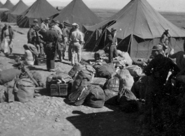 GI bags piled for another move at a housing area at an American base in the CBI.