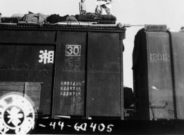 During WWII, photo showing the way refugees live atop freight cars on their way out of Kweilin (Gulin).  Take at the south station, Liuchow, China.