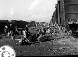 September 27, 1944  During WWII, long view of the south station, Liuchow, China, showing refugees packed atop freight cars in their attempt to flee the Japanese drive on Kweilin (Guilin).   Photo by Lt. N. J. Dain