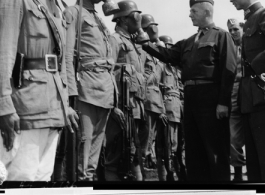 U. S. Brig. Gen. Haig Shekerjian, Torrenten, Conn., C.W.S., and Col. Li Jen Tsi, C.W., Inspect Chinese troops at I.T.C. during WWII.