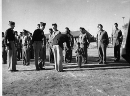 "Little Tiger Joe" stands inspection right along with his foster fathers, the 907th Engineers in the CBI (China) during WWII.