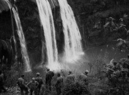 American GIs traveling through Guizhou province, near Anshun city, stop for a look at the dramatic Huangguoshu Falls during WWII. 