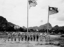 "Liuchow (Liuzhou)--retaken, first flag raising."  I In 1945, Chinese and Americans salute as two flags are raised in Liuzhou airbase, Guangxi province, China, during WWII.