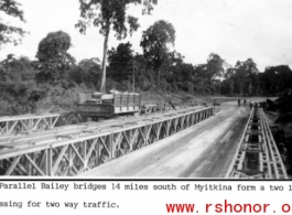 Parallel Bailey bridges 14 miles south of Myitkina form a two lane crossing for two way military traffic.   Photo from Henry Behmer.