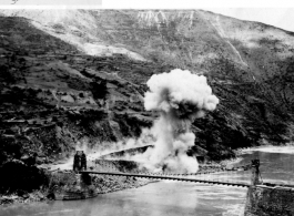 Detonating Japanese dud bomb from raid of August 23, 1944, at the Salween River Bridge.  Photo from Raimon B. Cary.