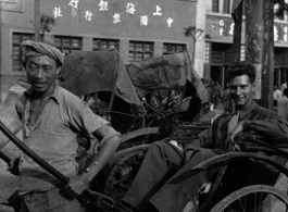 Bob Leavens poses riding a rickshaw in Guiyang (Kweiyang), China, in 1944.