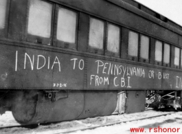 A train home in India, with the declaration "India to Pennsylvania or bust." After end of hostilities.