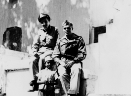 Flight Officer Clarke and Lt. Roland Speckman visit the Monkey Temple, during WWII. An unofficial guide accompanies them.