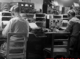Tightly packed radio room in the CBI during WWII, with American GIs busy at the equipment.