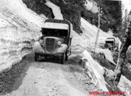 Trucks travel through mountain snow in the CBI during WWII.