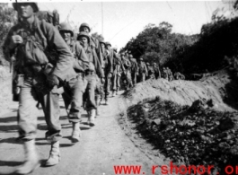 Soldiers of the Mars Task Force (124th Calvary Regiment ) marching in Burma on Christmas Day during WWII.