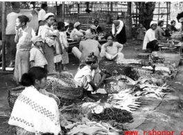 A farmer's market in SW China or Burma during WWII.  Photo from Samuel J. Louff.