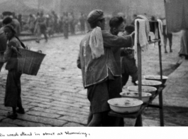 Public wash stand in Kunming, Yunnan province, China, during WWII.  Photo by A. H. Kitzerow, provided by Wilkinson.