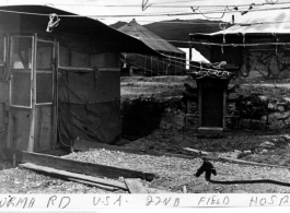 Wards and operating rooms of the 22nd Field Hospital's tent hospital at Kai Yuan. In the CBI during WWII. This hospital was apparently set up in some haste... notice the tombstone used to anchor the tent.  Photo from Wesley Furste.
