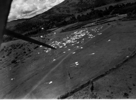 Parachute airdrop of supplies to Allied forces in Burma or SW China. In the CBI during WWII.