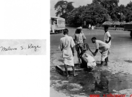 Civilians pump water in a public well in India during WWII.  Photo from Melvin S. Kaye.