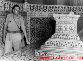 A GI examines an ornate tomb in India during WWII.  Photo from Bonds.