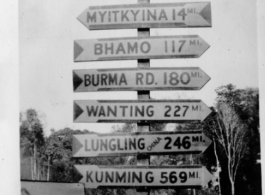 Heavily loaded sign post along Ledo Road, Burma, 1945.