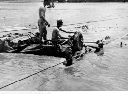 GIs float a jeep--wrapped in canvas to give it buoyancy--across the Moguang River in Burma, June 20, 1944.  Photo Raimon B. Cary. An identical image was submitted by Robert L. Cowan.