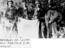 Members of 124th Cavalry Regiment (Mars Task Force), Headquarters Troops I & R, show of captured Japanese Good-Luck Flag  (寄せ書き日の丸) collected on the battleground in the CBI during WWII.