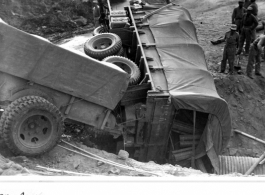 A truck of a Mars Task Force convoy crashed near Burma.  Photo from Henry Strong.