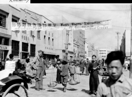 Busy street in Kunming during WWII, with GI taking it all in.  Photo from R. Hermann.