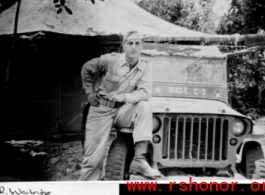 2nd Lt. J. R. Walridge leaning on jeep in the CBI, during WWII.