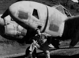 Rod Kelt poses with P-38 in Guangxi province, China, during WWII.
