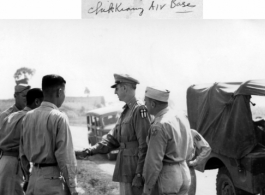 Gen. Wedemeyer shakes hand with soldiers during visit at Zhijiang air base.  In the CBI during WWII.