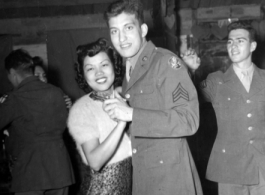 A young GI dances with an entrancing Chinese woman at a party and dance at the Hostel #10 Officer's Club on January 19, 1945. Another eager GI is reaching out to cut in, however.  Images provided by Dorothy Yuen Leuba.