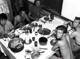 Young GIs enjoy a meal in the CBI during WWII.