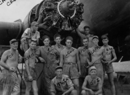 Engine change crew work on a C-47 transport plane in the CBI. 330th Troop Carrier, 9th CC. 1945.