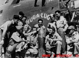 Flyers admire bomb in front of B-24 "Chug-A-Lug" during WWII.  Photo from Emery and Beth Vrana.