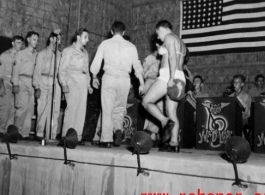 Acts change places--including a cross-dressing GI--while the band Jive-o-Lieps plays music in the CBI during WWII. 54th Air Service Group.