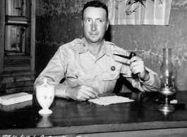 A US Army Air Force captain at a desk in China in WWII, in April 1945.