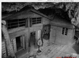 HQ in a cave in Guilin, Guangxi, China, with Chinese guard standing watch.