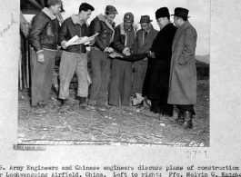 U. S. Army Engineers and Chinese engineers discuss plans of construction for Laohuangping Airfield, Guizhou, China.  Pfc. Melvin G. Watchorn, Pfc. Peter G. Bergum, Lt. James E. Beard, Capt. James F. Sabel, Parker Kwan, Siang Ting Chang, and James Sun.  Image courtesy of Tony Strotman.
