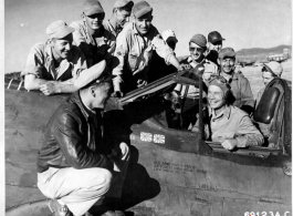 Joe E. Brown, touring bases in China, sits in a P-40 (serial #42-9768).  This is probably in Yunnan province, China.