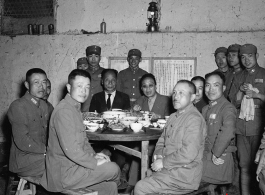 Table of ranking local Nationalist leadership during the banquet at the rally. In foreground, left, is Chinese Lt. General Du Yuming, commander of Nationalist 5th Corps (第五集团军总司令兼昆明防守司令杜聿明). On right is Gen. Wei Lihuang (卫立煌).   The general seated on the far left is Qiu Qingquan (邱清泉).  In the back are two KMT civilian officials. The one on the right is likely An Zefa (安则法), a highly educated official who had a number of roles in Yunnan during WWII.