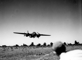 An American B-25 bomber flies at minimum altitude, probably during training/practice of 'low-level attack techniques', for 'skip bombing'. During WWII.  B-25 pilots of the Tenth Air Force (341st Bomb Group) and Chinese-American Composite Wing (1st Bomb Group) were trained in 'skip bombing' in India during 1943 and 1944.