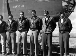 A crew of the 11th Bomb Squadron, 341st Bomb Group, stands beside a B-25 "Tokyo Jo" somewhere in China on 2 February 1943.  They are:  Capt. E. W. Holstrom Lt. L. J. Murphy Capt. Clayton Campbell Lt. George A. Stout T/Sgt. Douglas V. Radney S/Sgt. Robert T. Schafer
