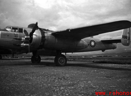 A B-25 with Nationalist markings, tail number #B31205, with bombs laid out ready for loading, at the American air base at Luliang in WWII in Yunnan province, China.