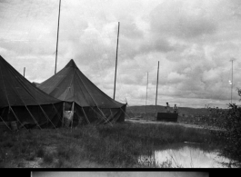 Radio station tents and towers, with antennas, at an American air base in WWII in Yunnan province, China.