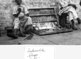 Sidewalk shop in Calcutta, India, during WWII.
