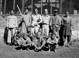 Chinese and American personnel--with sharp knives--at a beef slaughterhouse at Yangkai, set up specifically to provide meat for base personnel. During WWII.