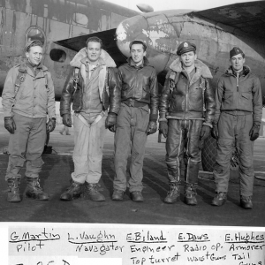 Pilot George Martin and his crew pose before a B-25-D during WWII. L-R: L. Vaughn, E. Biland, E. Daws, and E. Hughes.